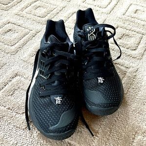 Black Nike pair of athletic shoes